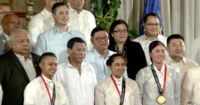 GOLDEN GIRLS. President Duterte poses for a photo with Asian Games gold-medal winners Hidilyn Diaz of weigthlifting, skateboarding's Margielyn Didal, golf's Yuka Saso. RTVM screenshot 
