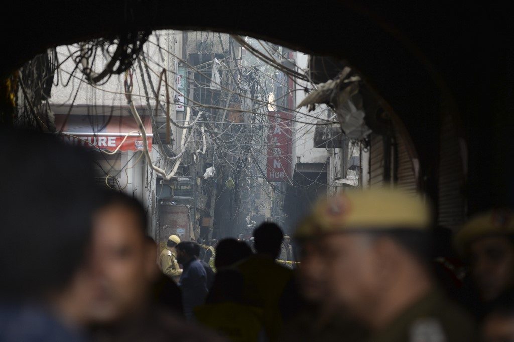 Screams and goodbyes as scores killed in devastating India factory fire