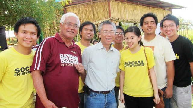 COMMITTED. Camille with her fellow Gawad Kalinga members and mentors Tony Meloto and Darwin Yu