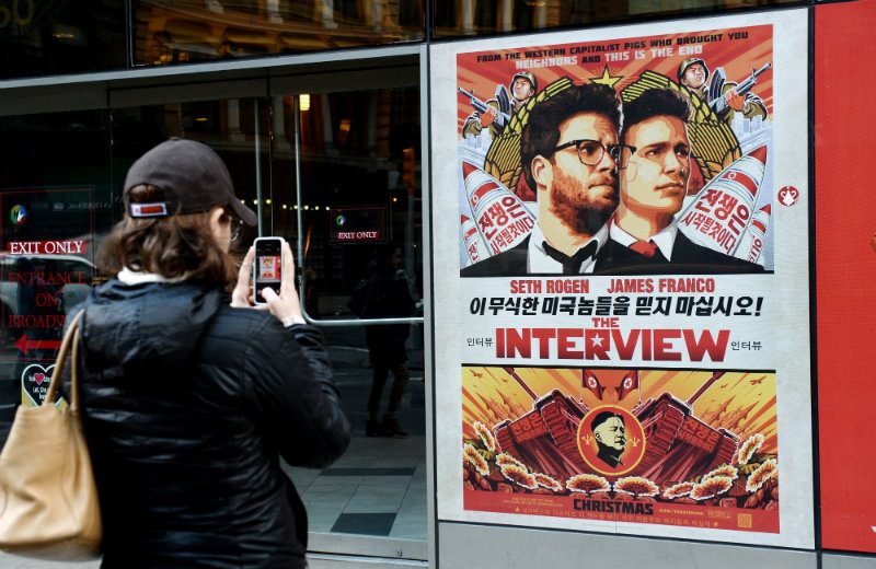 CONTROVERSIAL MOVIE. A woman takes a picture of a poster for Sony's film 'The Interview', which features a fictional plot wherein two US journalists embark on a mission to assassinate North Korean leader Kim Jong-Un. File photo by EPA/Justin Lane