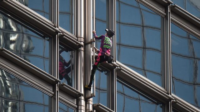 ‘French Spiderman’ scales Hong Kong skyscraper with ‘peace banner’