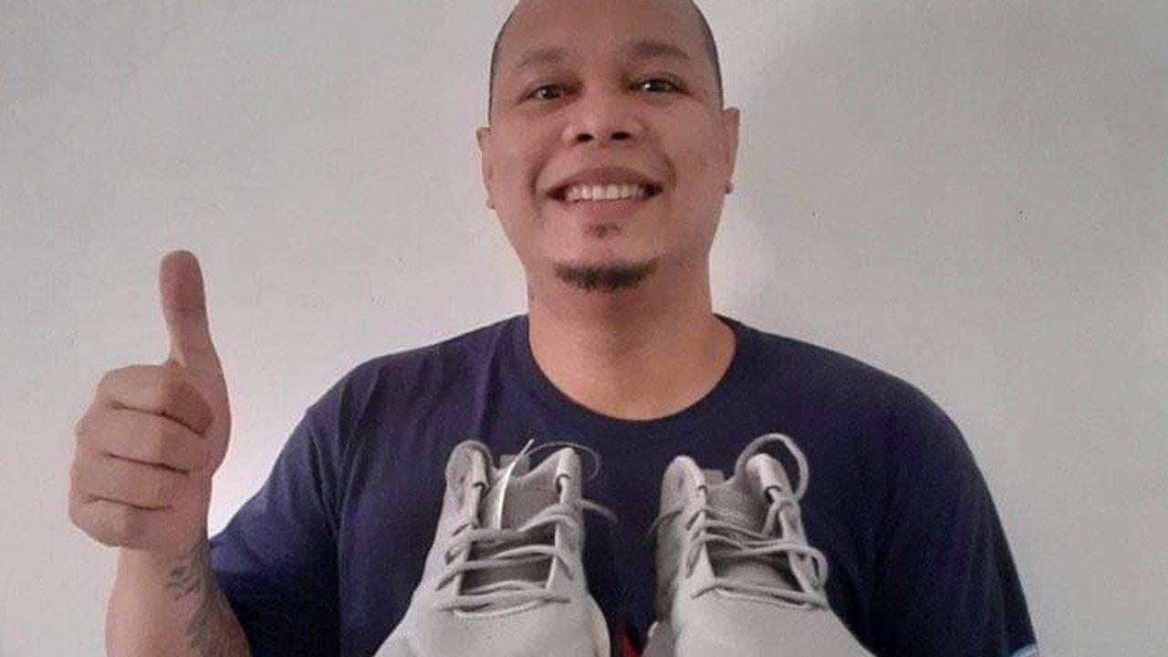 JAMES VELASCO. Through GrabPay, Grab was able to grant his wife's wish to give him a new pair of shoes. Photo by James Velasco
