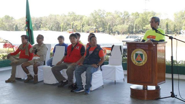 ADVOCATES. Lt Col Tamayo of the University of Perpetual Help system, Dr Ted Esguerra, Director Felino Castro of DSWD and other officials look on as Undersecretary Alexander Pama welcomes Rescue March participants at Fort Bonifacio. Image courtesy NDRRMC / Office of Civil Defense   
