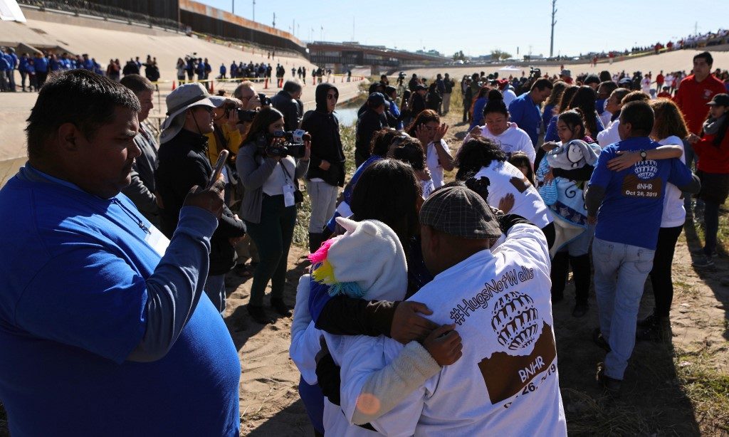 REUNITED. Mexican families separated by the border wall are reunited for 3 minutes in the 7th edition of the Hugs Not Walls event organized by the Border Network for Human Rights, in front of the border wall on the Rio Grande in Ciudad Juarez, Chihuahua state, Mexico on October 26, 2019. Photo by Herika Martinez/AFP 