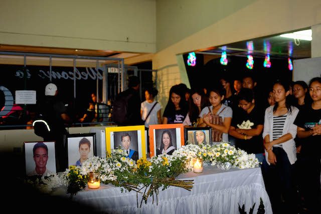 MOURNING. Friends and relatives honor the memory of some of the victims of the bus bombing