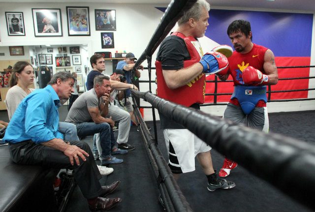 Stallone watched Pacquiao work the mitts. Photo by Chris Farina - Top Rank 