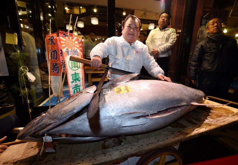 Japan’s historic Tsukiji fish market holds final New Year auction