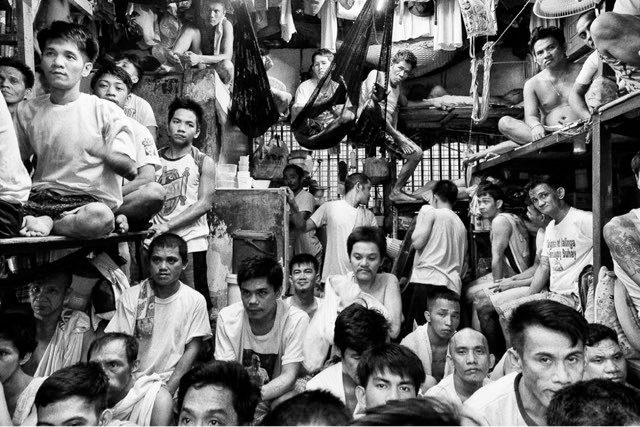 NAVOTAS CITY JAIL DETAINEES. 
The Philippines has the most crowded correctional system in the world. This image appeared in Rocamora's 2018 photobook Human Wrongs, a six-year project that documented life inside Philippine detention centers. File photograph: Rick Rocamora 