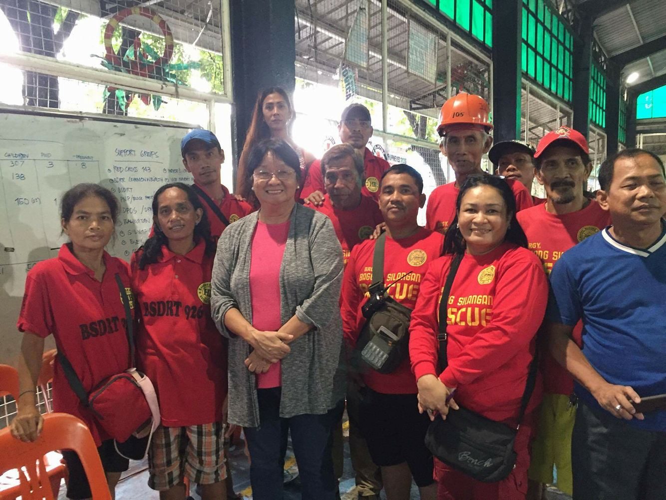 EVACUATION CENTER. DSWD Secretary Judy Taguiwalo and volunteers visit an evacuation center in Barangay Bagong Silangan, Quezon City, on August 14, 2016. Photo by DSWD  