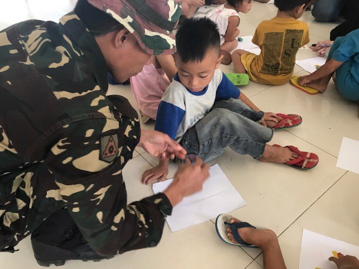 EVACUATION CENTERS. Through the psychosocial program, the soldiers hope to help divert the children’s attention away from the trauma caused by the war.   