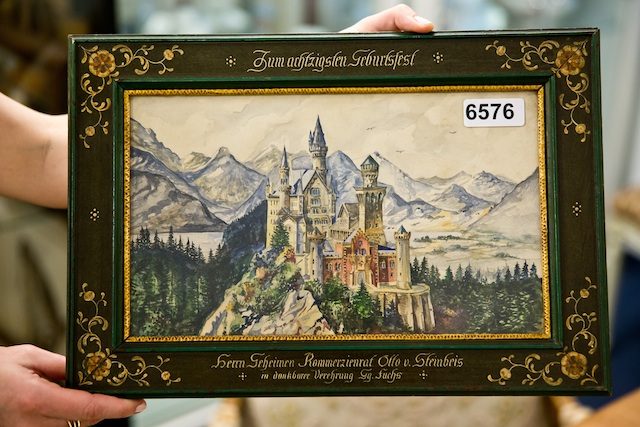 HITLER PAINTING. The frame of the watercolor painting 'Neuschwanstein', that is inscribed 'To the 80th birthday of Kommerzienrat (lit. councillor of commerce) Otto von Steinbeis', is on display at an auction house in Nuremberg, Germany, 12 June 2015. The painting is attributed to Adolf Hitler and will go under the hammer at the auction house Weidler on 20 June 2015. EPA/DANIEL KARMANN 