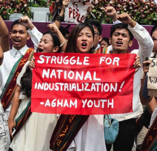 BETTER RESOURCES. A science education graduate holding up a streamer calling for national industrialization during graduation rites in the University of the Philippines - Diliman. Image courtesy of Agham Youth   