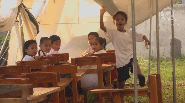 TEMPORARY CLASSROOMS. Students hold class in temporary classrooms in Albay as school buildings are being used as evacuation centers. Photo by Naoki Mengua/Rappler