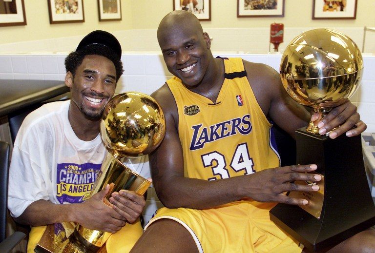 Kobe Bryant and Shaquille O'Neal celebrate their first NBA title together after defeating the Indiana Pacers in 2000. The two would quarrel many times as teammates but are a big part of each other's legacies. Photo by AFP 