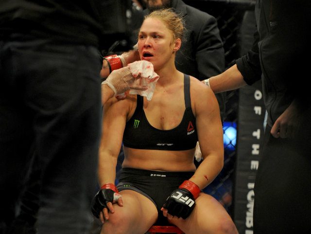 WATCH: Rousey hides face as she returns home after loss to Holm