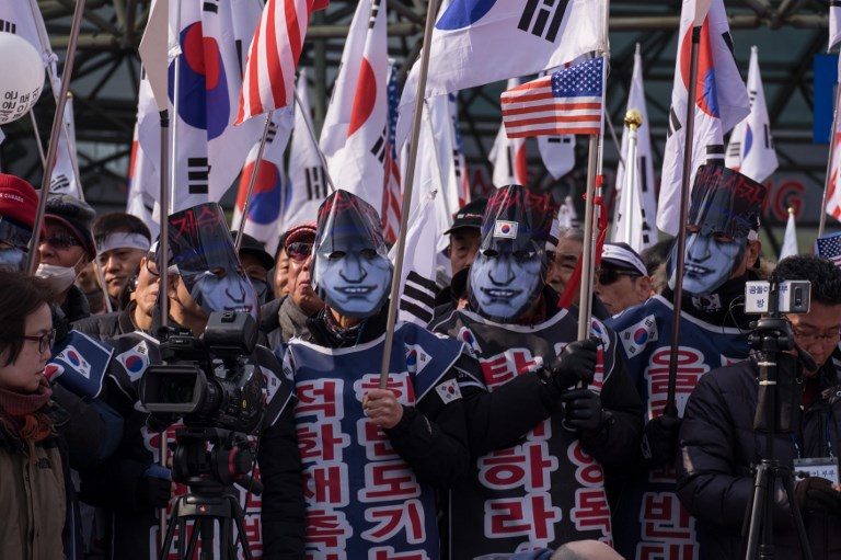 Relatives protest visit by N. Korea general blamed for warship sinking