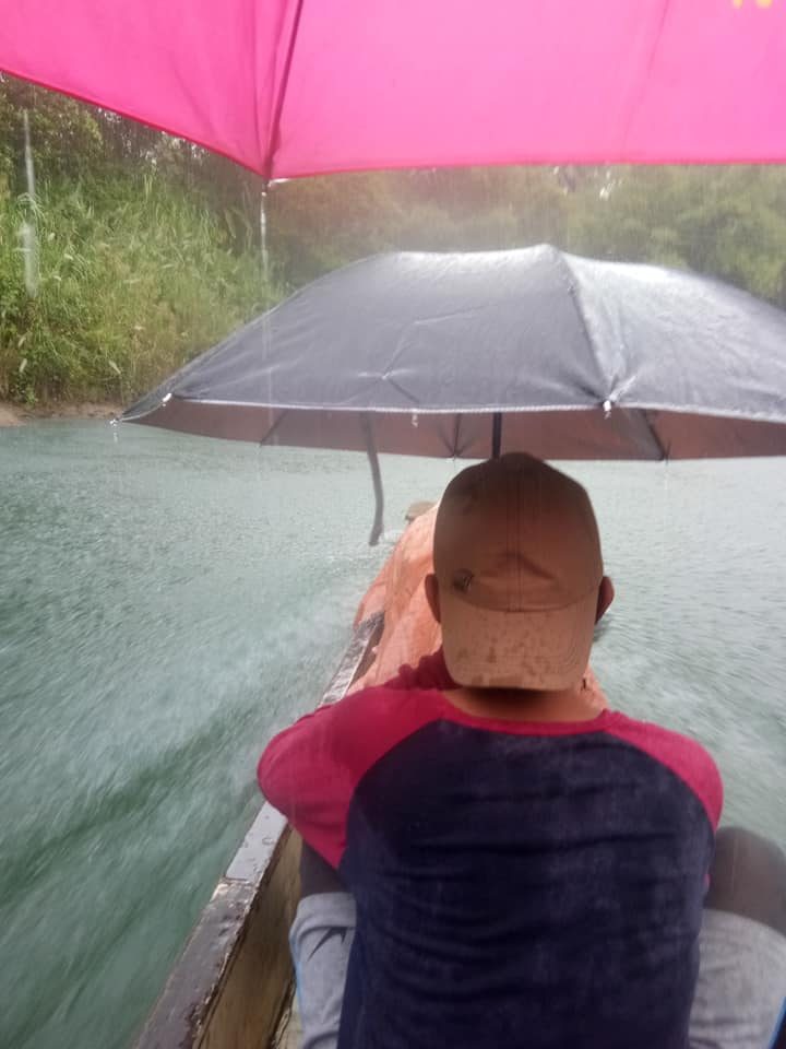  RISKY RIDE. David Refuncion, along with 7 other teachers, would sometimes have to ride a boat under the pouring rain just to reach Mabini I elementary school. Photo from David Refuncion
