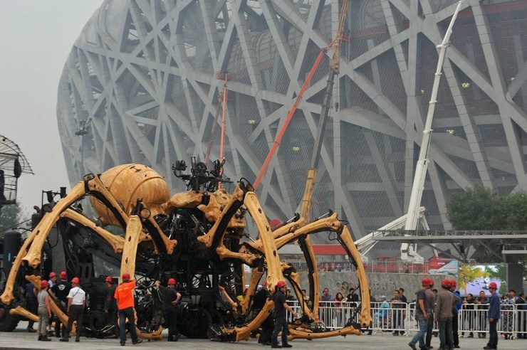 GIANT SPIDER. Staff adjust the French mechanical installation 'the spider' at the center of the Olympic Green in Beijing before the French mechanical 'LongMa' kicks off. Photo by Mandy Wang/Rappler
