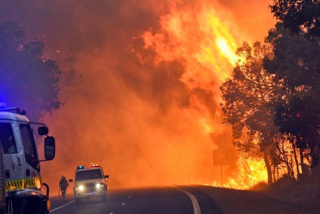 Two dead as firefighters battle huge Australia bushfire