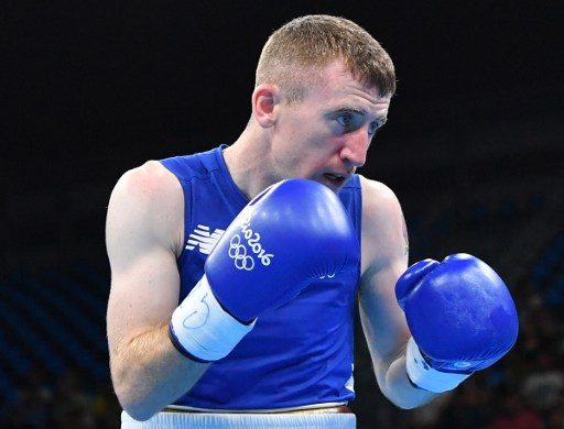 On verge of vomiting, boxing medal favorite Barnes ousted early