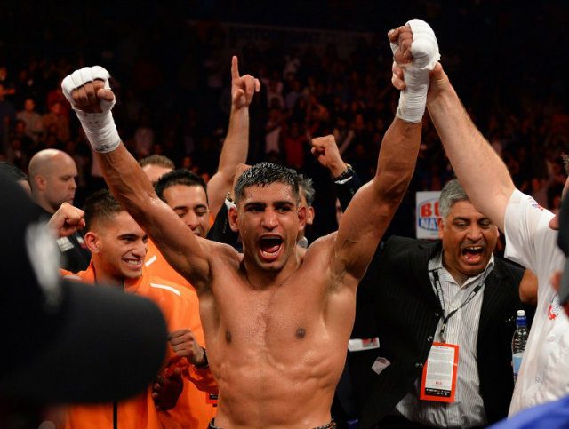 WINNER. Welterweight boxer Amir Khan is declared winner. Photo by Andrew Yates/AFP  