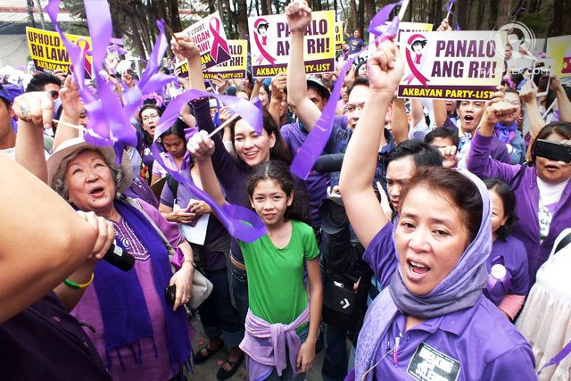RH WINS. Health advocates celebrate their victory. File photo by Rappler