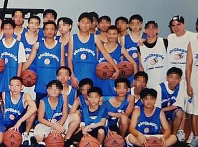 TEAM PHOTO. Josiah Weihman (bottom left) and other kids pose for a photo with coach Leo Arnaiz (top right) after a basketball camp in Baguio City. Photo from Adidas Basketball Camp 
