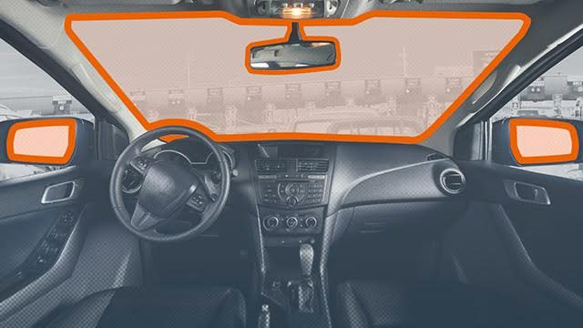 NO DISTRACTIONS. Under the Anti-Distracted Driving Act, devices cannot be placed anywhere that may obstruct the driver's line of sight (highlighted in orange).  