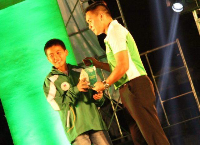 Joaquin Buyco receives an award for his athletic achievements. Photo courtesy of Keith Buyco 