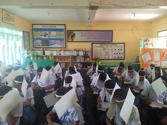 Teacher explains use of ‘anti-cheating’ headbands