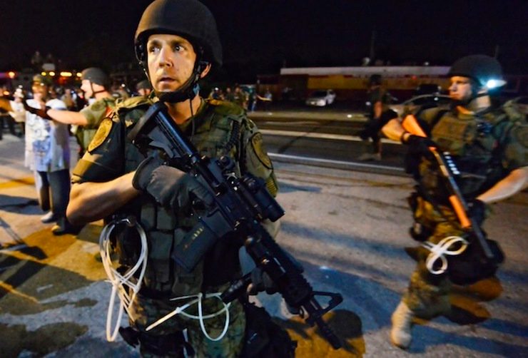 Police hold back on tear gas at Ferguson protest