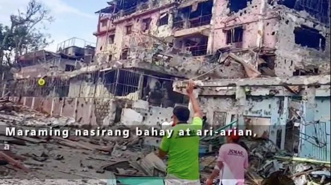 DESTRUCTION. Military airstrikes target buildings that terrorists use as fortifications. Screenshot of a military video   