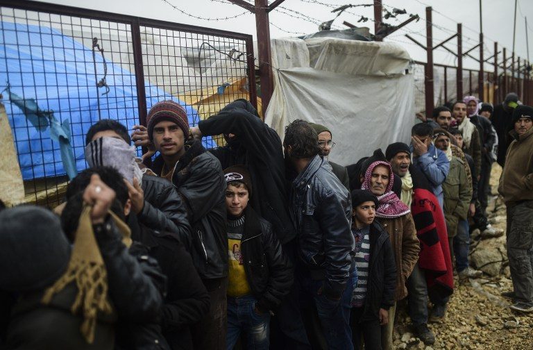 Thousands brave cold at Turkey border as Syria warns Riyadh, Ankara