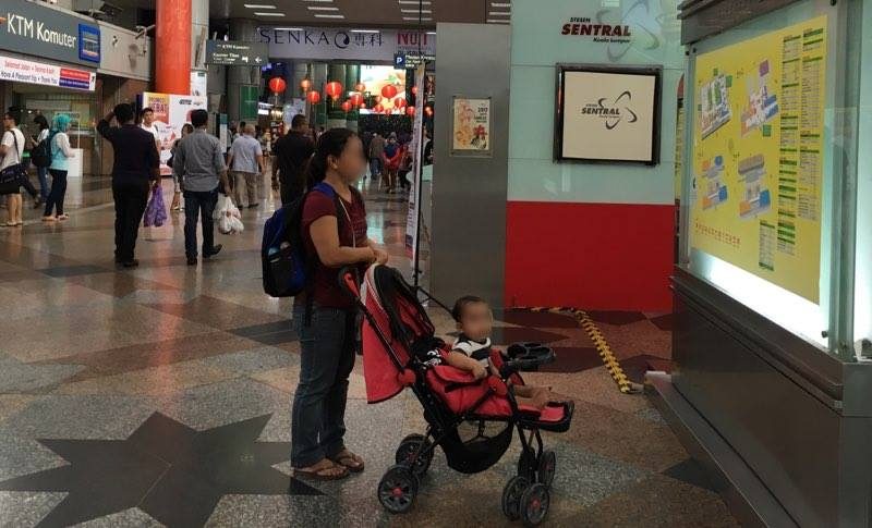 UNDOCUMENTED. 37-year old Erika* with her 11-month old son in Kuala Lumpur. Photo by Camille Elemia/Rappler.com 