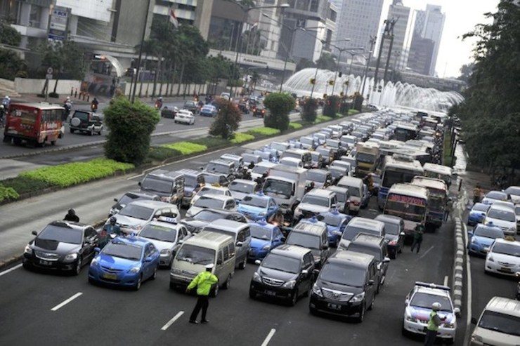 In this photograph taken on February 10, 2012 cars and public transports are jammed during rush hour traffic at Jakarta's main Thamrin avenue. Photo by Romeo Gacad/AFP

