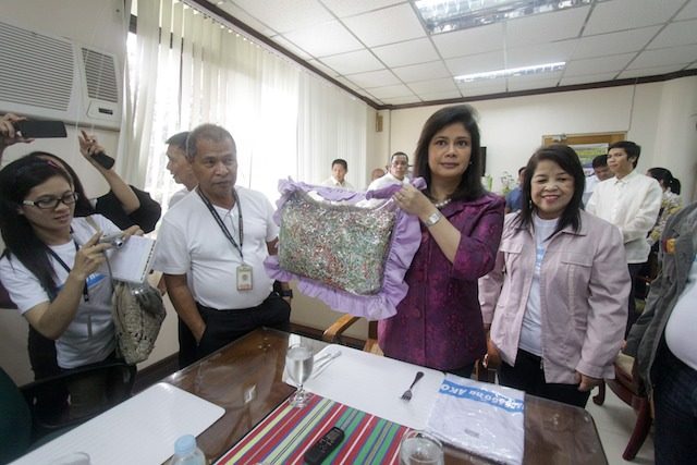 LIVELIHOOD. Gingoog City Mayor Marie Guingona shows the pillow made of recycled materials from its materials recovery facilities. 