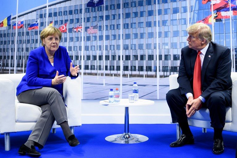 Trump and Merkel clash at fraught NATO summit