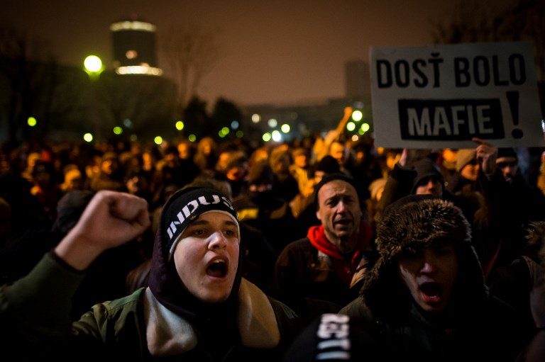 Thousands attend protest vigils for slain Slovak journalist