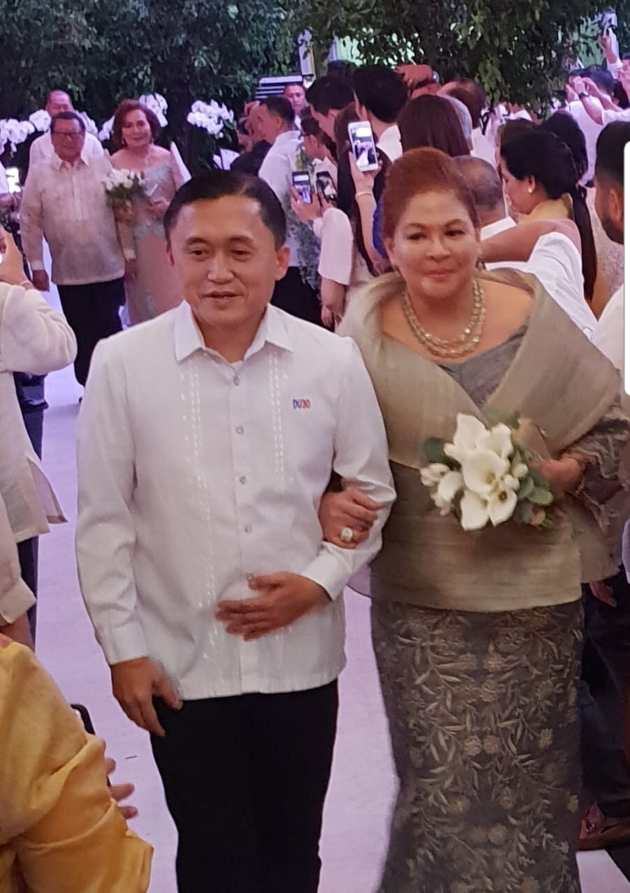 NINONG. Bong Go at the Koko Pimentel-Kathryna Yu wedding. He is with Isabelle Faeh, one of the ninangs. Photo by Ron Munsayac   