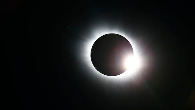 Tourists flock to Indonesia for rare total solar eclipse