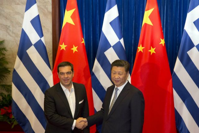 HEAD OF THE DRAGON. Greek Prime Minister Alexis Tsipras (L) shakes hands with Chinese President Xi Jinping during a meeting at the Great Hall of the People in Beijing on July 5, 2016. File photo by Ng Han Guan/Pool/AFP 