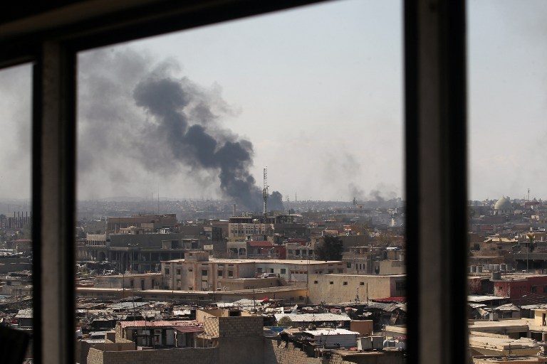 Mosul exodus as air strikes kill ‘dozens’