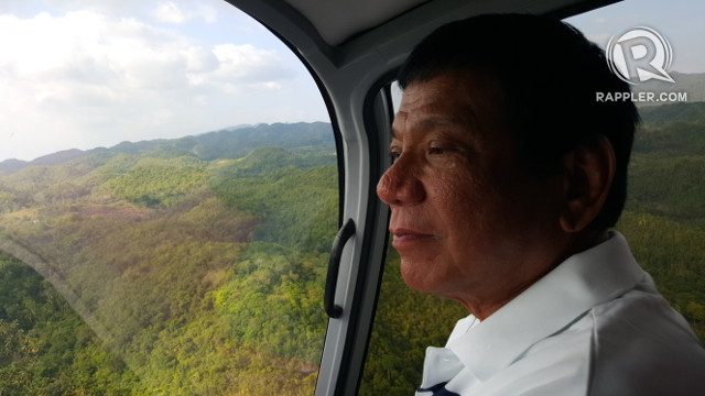 QUIET MOMENT. Duterte savors a moment of peace during a chopper ride in between sorties in Leyte. Photo by Pia Ranada/Rappler 
