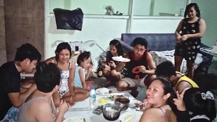 MAKING DO. Maymay Canopin shares a meal with her fellow masseuses and masseurs. Photo from Canopin