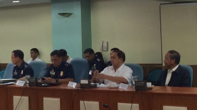 WHAT COMPANY? Former police general Ireno Bacolod (rightmost) faces lawmakers during an inquiry on an alleged shady deal between the PNP and a courier company. Photo by Rappler