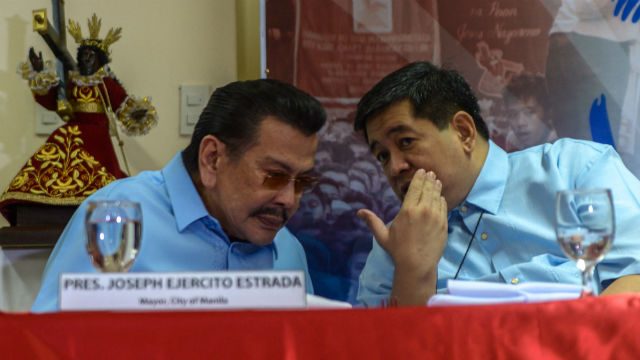 CHURCH AND STATE. Manila Mayor Joseph Estrada and Msgr Clemente Ignacio exchange views during the media conference of the Feast of Black Nazarene 2015. Traslacion 2015 will start on January 9, 2015 at the Quirino Grandstand. Photo by Jansen Romero/Rappler