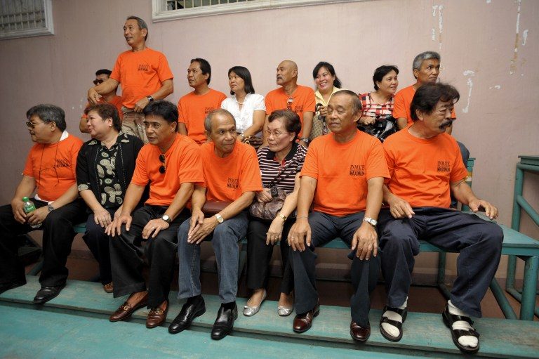 FREE. Convicted soldiers (in orange) for the 1983 murder of Ninoy Aquino and Rolando Galman released from prison in 2010. Photo by Jay Directo/AFP   