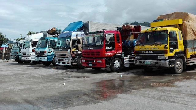 STRANDED CARGO. Trucks carrying cargo are not allowed to load at the Port of San Andres in Catanduanes. Photo from the Philippine Coast Guard  