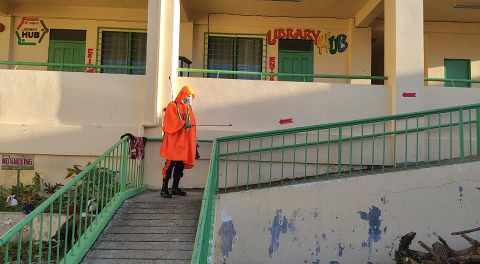 DISINFECT. San Jose Central Fire Station personnel disinfect the San Jose Elementary School in Dinagat Islands. Photo from San Jose Bureau of Fire Protection 