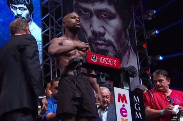 Floyd Mayweather steps on the scales 
